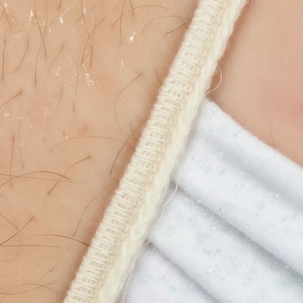 Healthy skin contact with organic cotton fabric, illustrating reduced irritation.